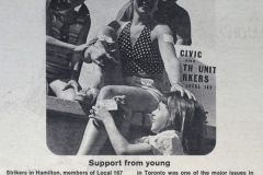 A child enthusiastically covers a Local 167 member with strike-support stickers, November 1973. Courtesy of CUPE Journal.